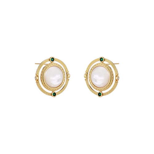 Circular gold stud earrings with iridescent mother-of-pearl center and green zirconia accents on cream background.