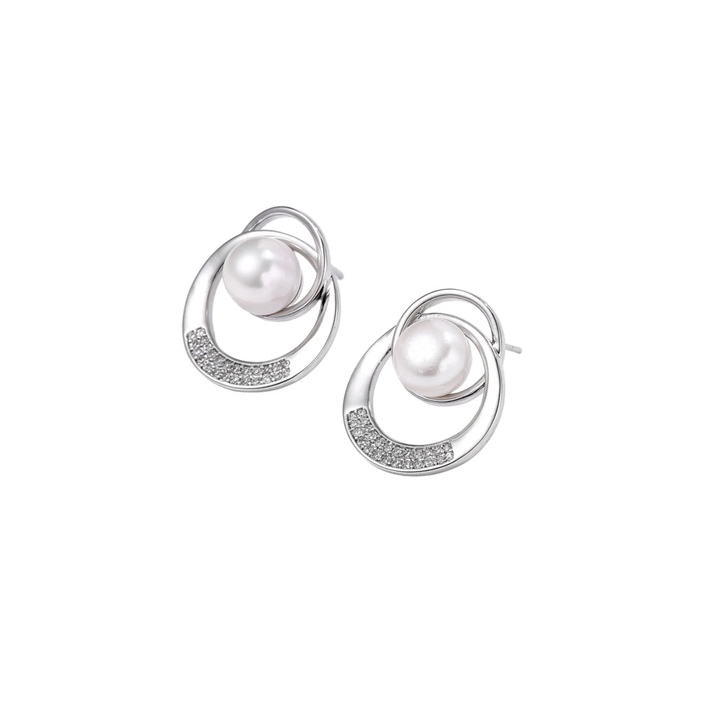White gold-plated brass earrings with circular design, freshwater pearl center, and diamond accents