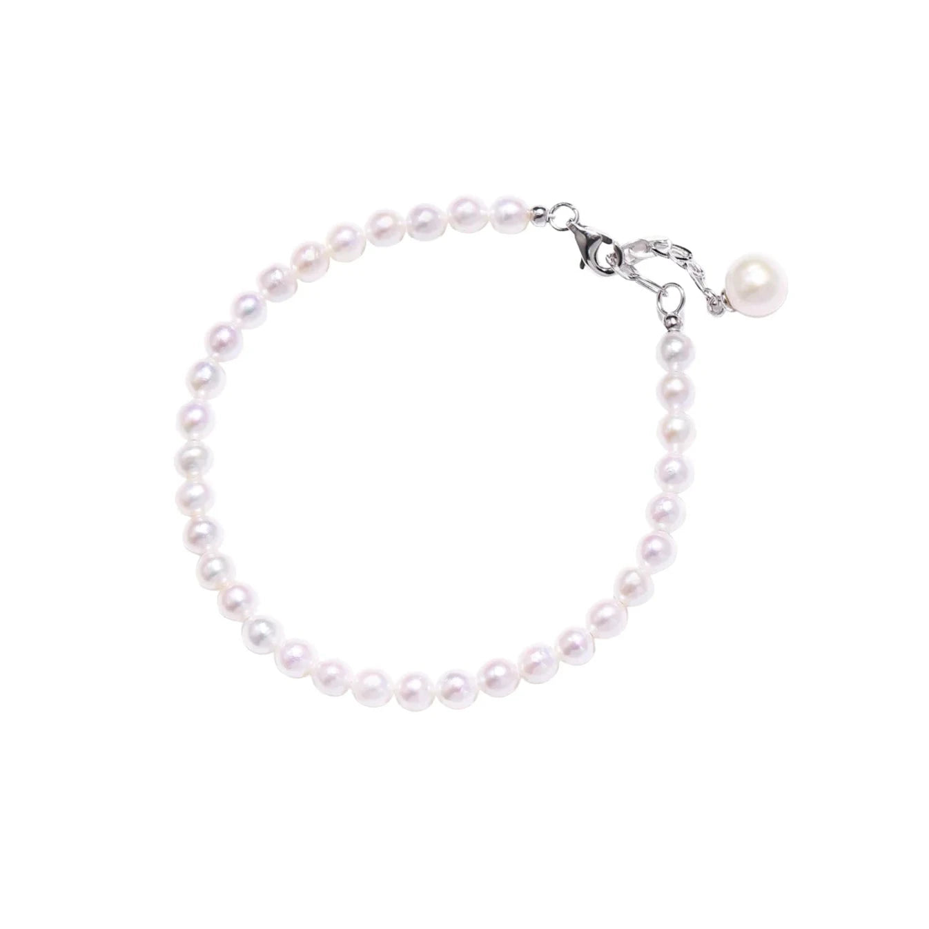 Delicate freshwater pearl bracelet with rhodium-plated silver clasp and single pearl drop charm on cream background