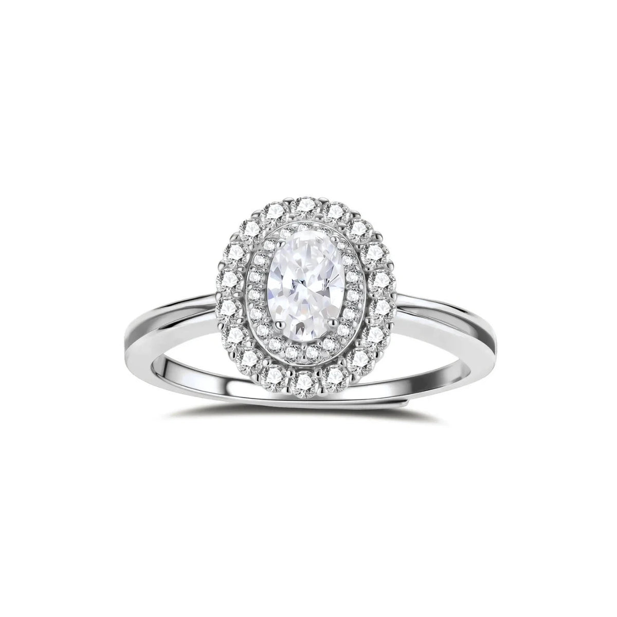 Sterling silver ring with oval moissanite center stone surrounded by double halo of sparkling stones on neutral background.