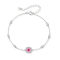 Elegant sterling silver chain bracelet featuring pink moissanite center stone in cushion halo setting with adjustable clasp