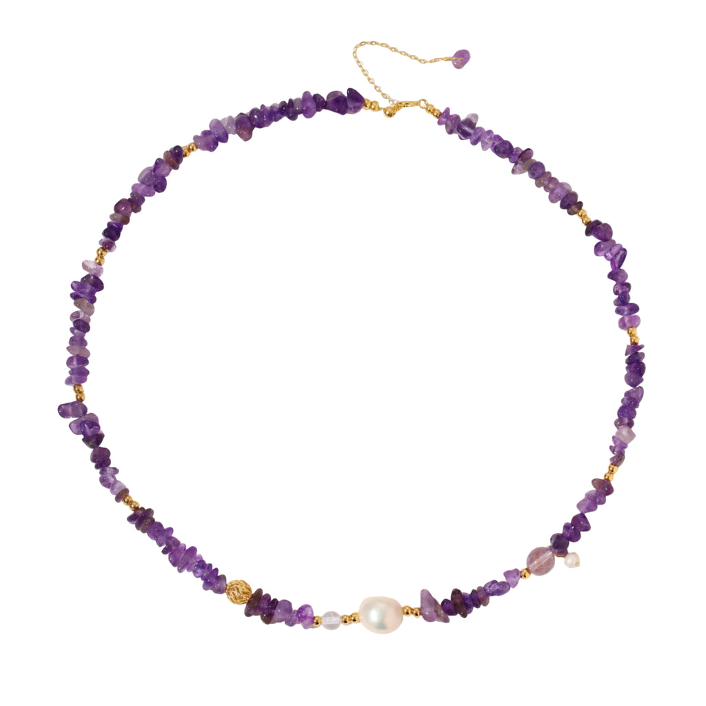 Beaded necklace with purple amethyst chips, freshwater pearls, and gold accents on white background.