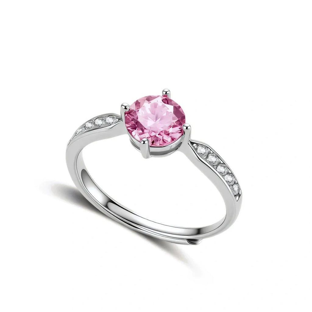 Brilliant pink moissanite ring in sterling silver 4-prong setting with accent stones on adjustable band