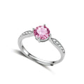 Brilliant pink moissanite ring in sterling silver 4-prong setting with accent stones on adjustable band