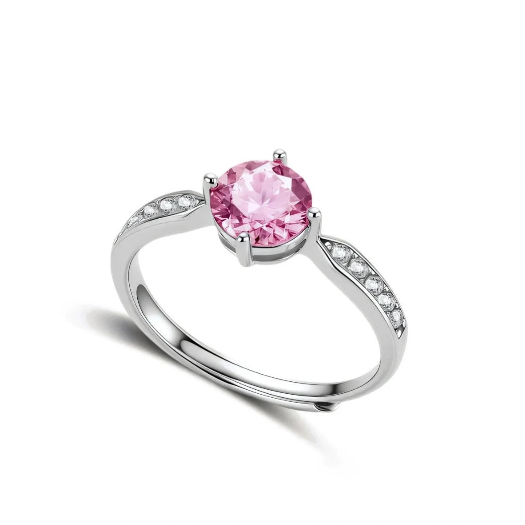 Brilliant pink moissanite ring in sterling silver 4-prong setting with accent stones on adjustable band
